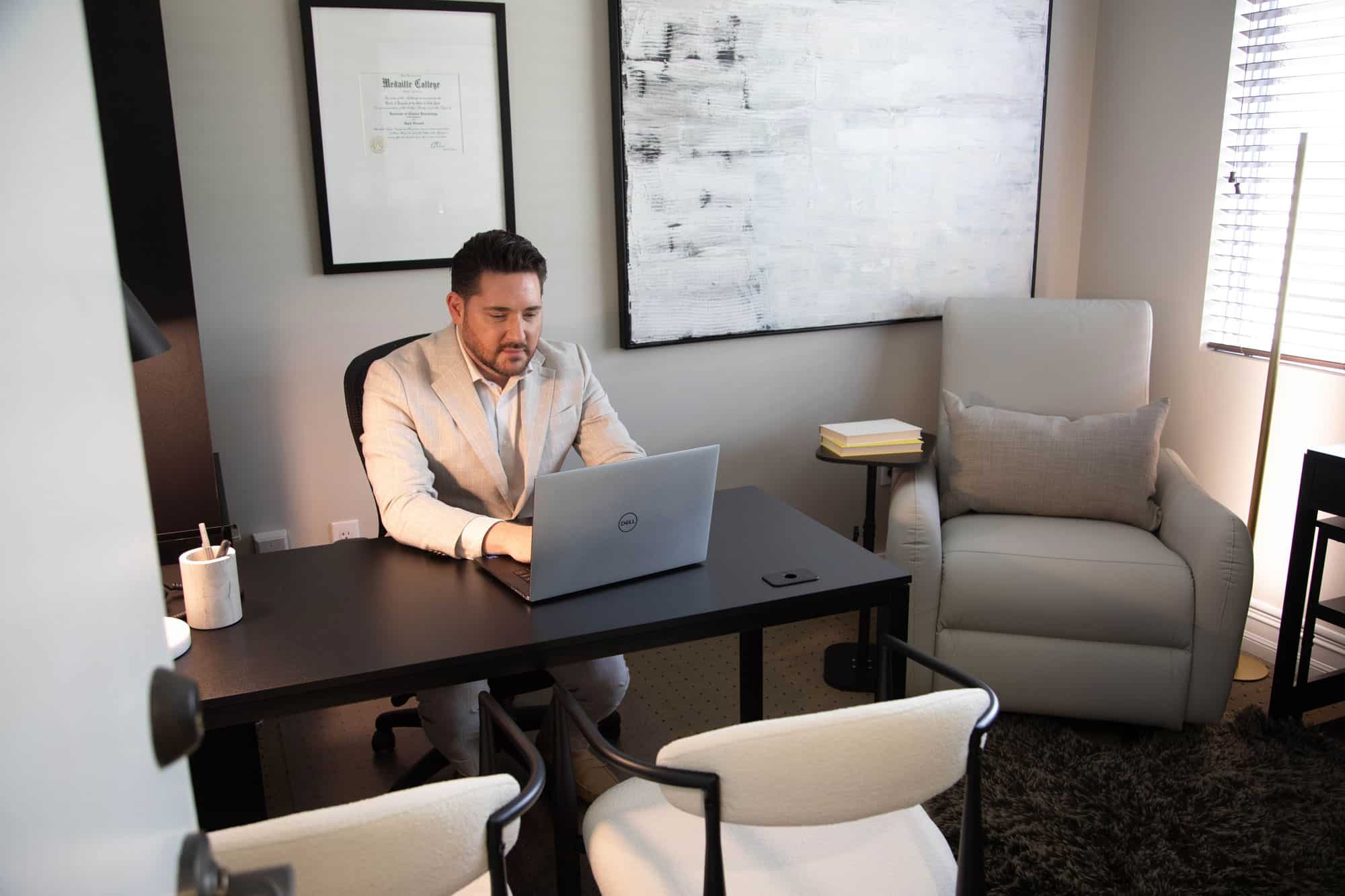 Dr. Forstadt working at desk